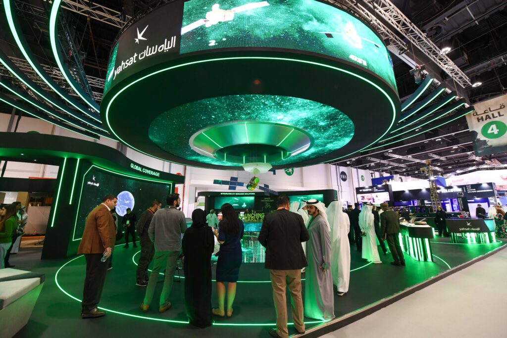 Visitors at a n exhibitor's stall at IDEX 2023 at ADNEC Centre Abu Dhabi